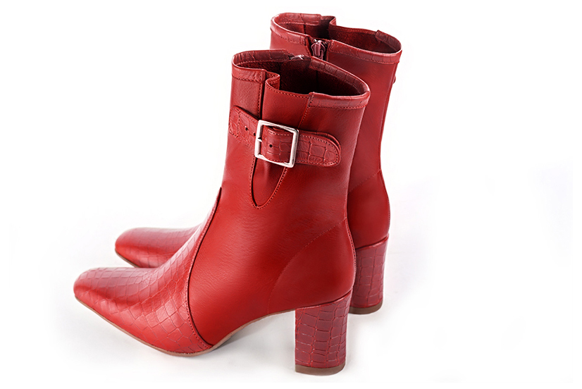 Scarlet red women's ankle boots with buckles on the sides. Square toe. Medium block heels. Rear view - Florence KOOIJMAN